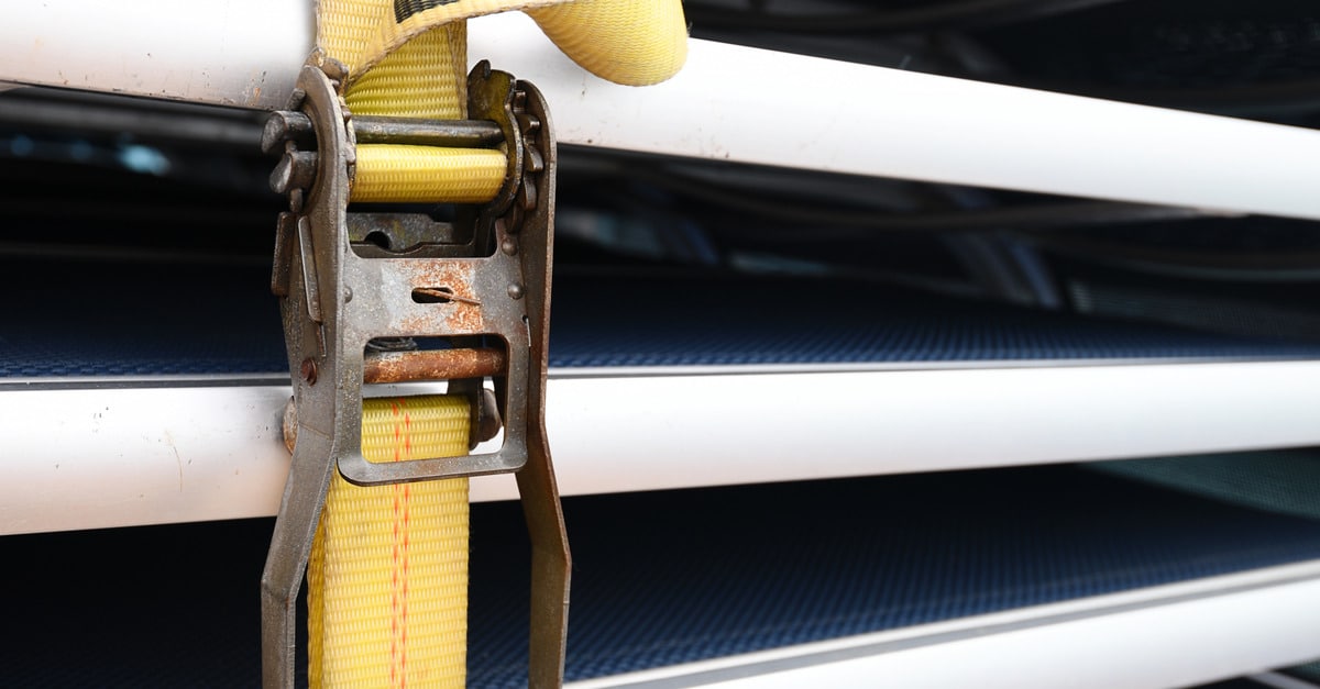 LogistickInc-332300-yellow-ratchet-strap-image1 Metal patio chairs are secured tightly in place with bright yellow ratchet straps for added stability and safety.